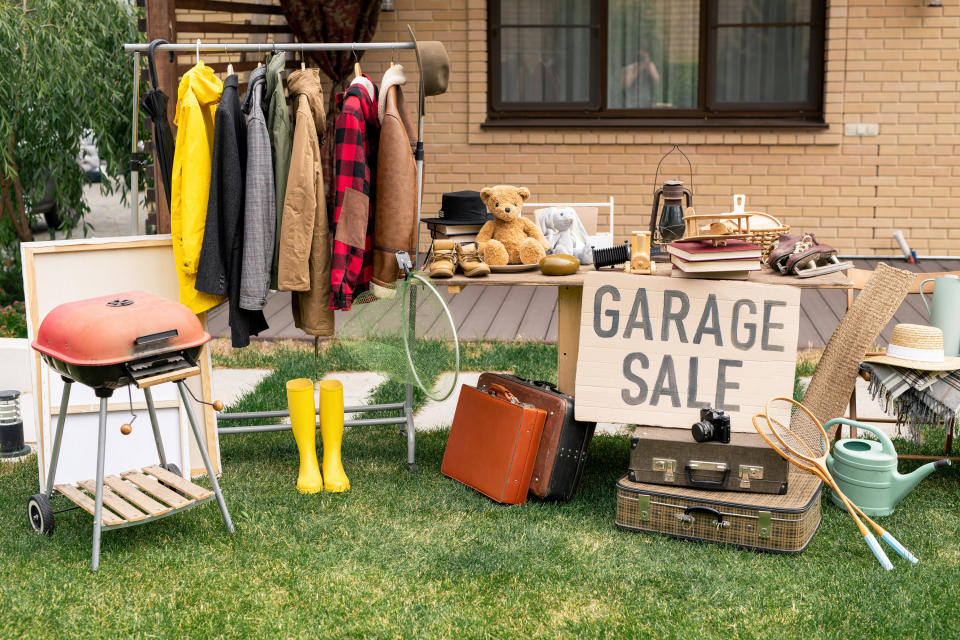 items set up in a yard for a garage sale