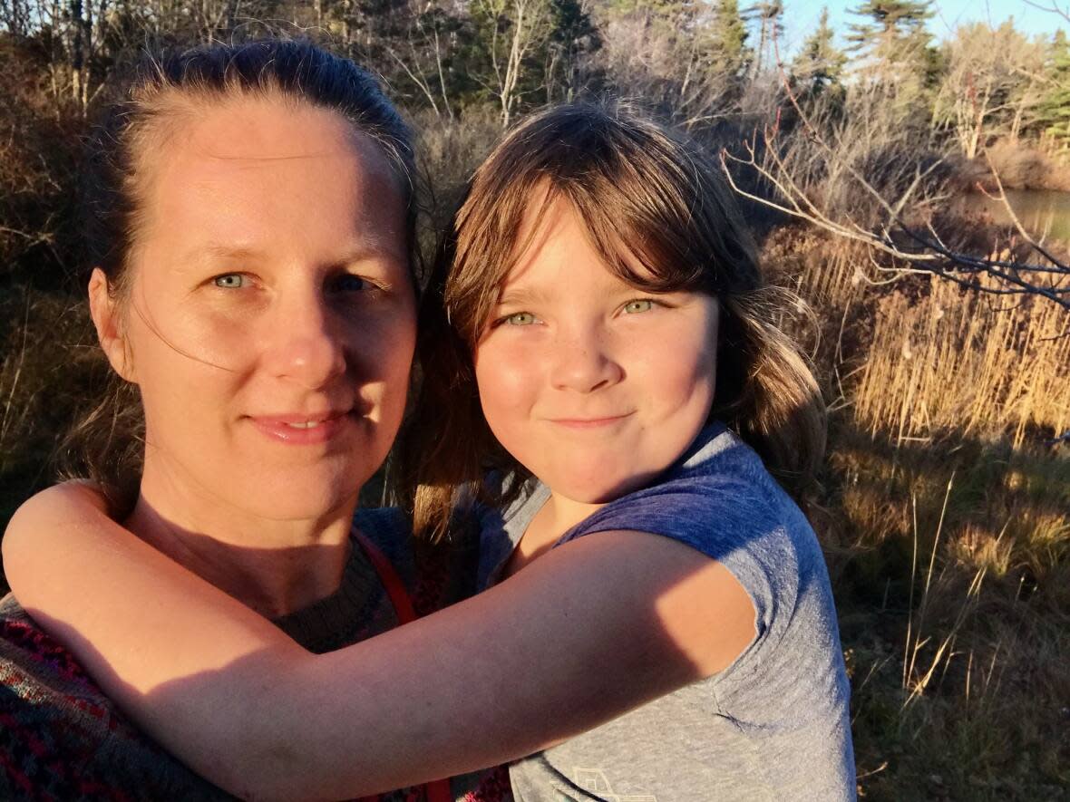 Paula Cameron with her eight-year-old daughter, Maddy. Cameron is raising money for her daughter to get surgery for tethered cord syndrome. (Paula Cameron - image credit)