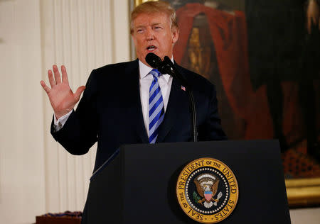 U.S. President Donald Trump talks about banning devices that can be attached to semiautomatic guns to make them automatic, during a Public Safety Medal of Valor Awards Ceremony at the White House in Washington, U.S., February 20, 2018. REUTERS/Leah Millis