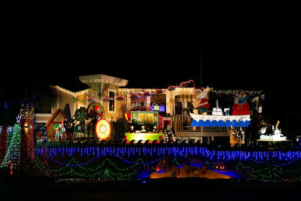 Several Christmas displays, including one of Santa Claus and Mrs. Claus fishing, are featured at the Mazoch home at 15301 Isabella Court in Corpus Christi Thursday, Dec. 14, 2023.