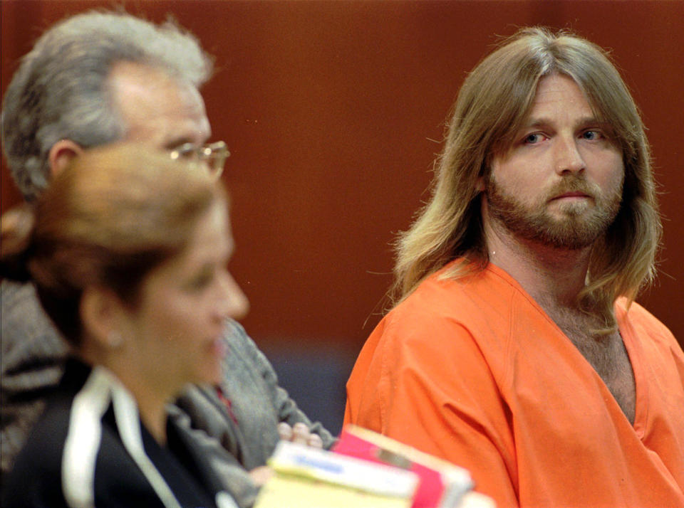 FILE - In this July 8, 1996 file photo, convicted murderer Glen Rogers, right, stares at Public Defender Joan Corces during a hearing in Tampa, Fla.  A documentary set to air Wednesday, Nov. 21, 2012, says Rogers, who is on Florida's death row, could know something about the murder of OJ Simpson's wife Nicole and her friend Ron Goldman (AP Photo/Chris O'Meara, File)