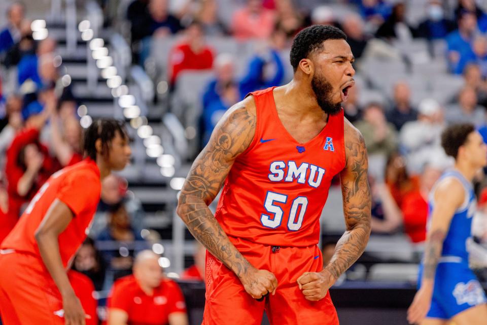 SMU forward Marcus Weathers (50) celebrates after making a basket during the first half of an NCAA college basketball game against Memphis in the semifinals of the American Athletic Conference tournament in Fort Worth, Texas, Saturday, March 12, 2022. (AP Photo/Gareth Patterson)