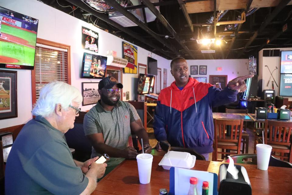 Richard Coleman, Democratic candidate for Chatham County Sheriff, watches as election night results come in on Tuesday, May 21, 2024 at Coach's Corner in Thunderbolt.