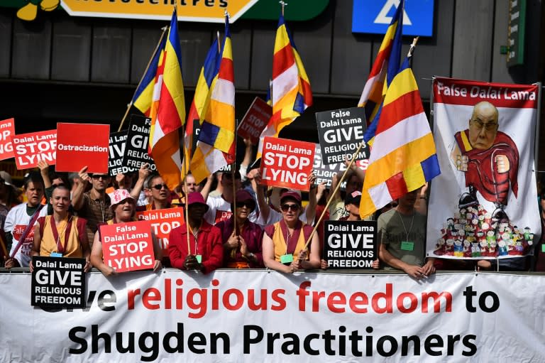 Members of the International Shugden Community protest outside the Aldershot football club ahead of the arrival of the Dalai Lama on June 29, 2015