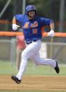 <p>Tim Tebow reacts after hitting a solo home run in his first at bat during the first inning of his first instructional league baseball game for the New York Mets against the St. Louis Cardinals instructional club Wednesday, Sept. 28, 2016, in Port St. Lucie, Fla. (AP Photo/Luis M. Alvarez) </p>