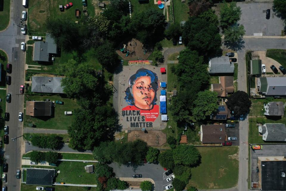 <div class="inline-image__caption"><p>A large-scale ground mural depicted Breonna Taylor with the text 'Black Lives Matter' at Chambers Park on July 5, 2020 in Annapolis, Maryland. Taylor was unarmed when she was shot and killed by police in her home.</p></div> <div class="inline-image__credit">Patrick Smith/Getty</div>