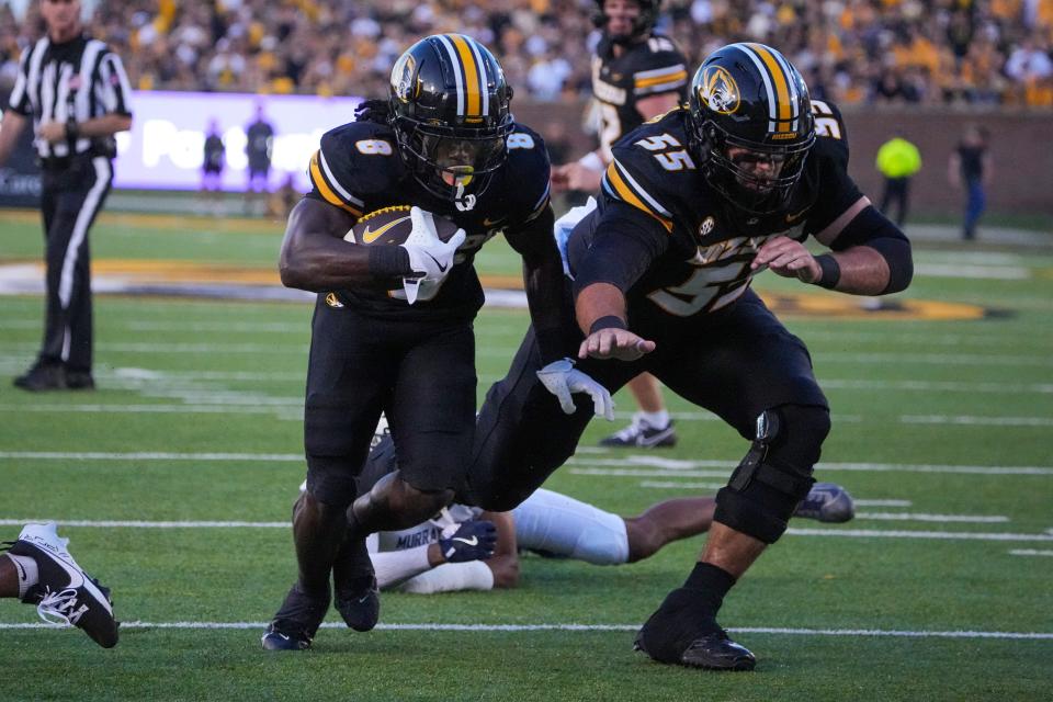 Aug 29, 2024; Columbia, Missouri, USA; Missouri Tigers running back Nate Noel (8) scores as offensive lineman Connor Tollison (55) blocks against the Murray State Racers during the first half at Faurot Field at Memorial Stadium. Mandatory Credit: Denny Medley-USA TODAY Sports