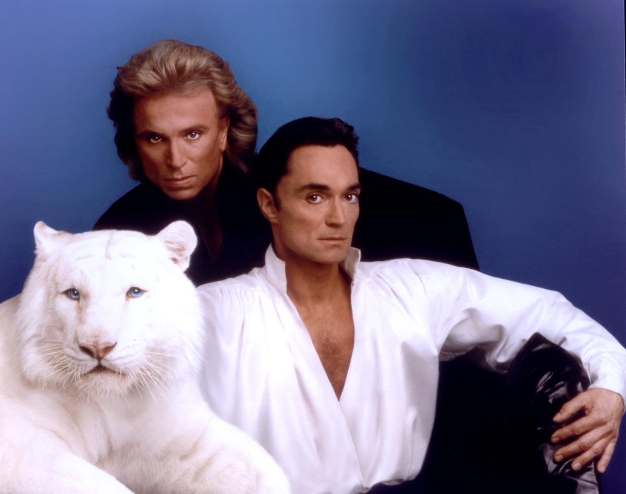 The pair pose with a white tiger in 2000, soon after they were honored as Magicians of the Century.