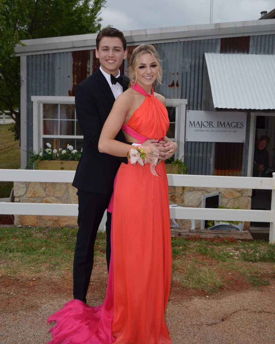 <p>The <em>Dance Moms </em>star slayed her first ever prom in a stunning neon pink and orange gown. She went with her friend Cole Cannon, saying that she "wouldn’t have wanted to attend my first prom with anyone else." Awww!</p>