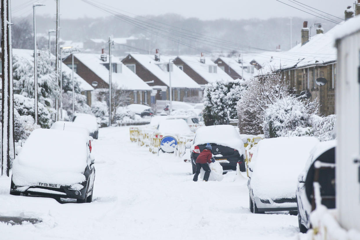  A child rolls a snowball in the West Yorkshire village of Honley. Heavy snow fell overnight in West Yorkshire, causing dangerous driving conditions. (Photo by Adam Vaughan / SOPA Images/Sipa USA) 