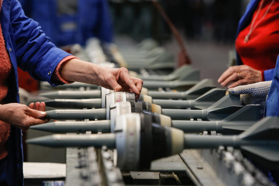 Workers at a Rostec plant manufacture ammunition for tanks in 2016.  (Mikhail Kireev / Sputnik via AP)