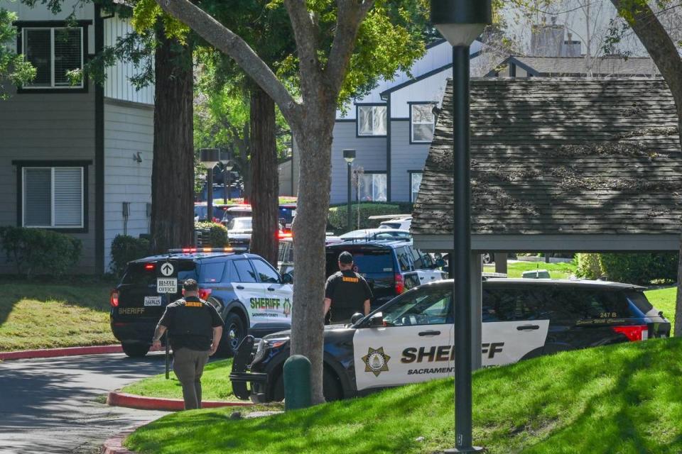 Officers arrive on the scene after gunfire erupted at the Hazel Ranch apartment complex in the 8800 block of Winding Way in Fair Oaks on Friday. Renée C. Byer/rbyer@sacbee.com