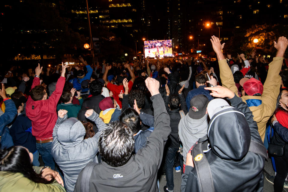 TORONTO, ON - JUNE 13: Toronto Raptors fans cheer as they watch Game 6 of the 2019 NBA Finals between Toronto Raptors and Golden State Warriors from a fan zone outside Scotiabank Arena on June 13, 2019 in Toronto, ON, Canada. (Photo by Julian Avram/Icon Sportswire via Getty Images)