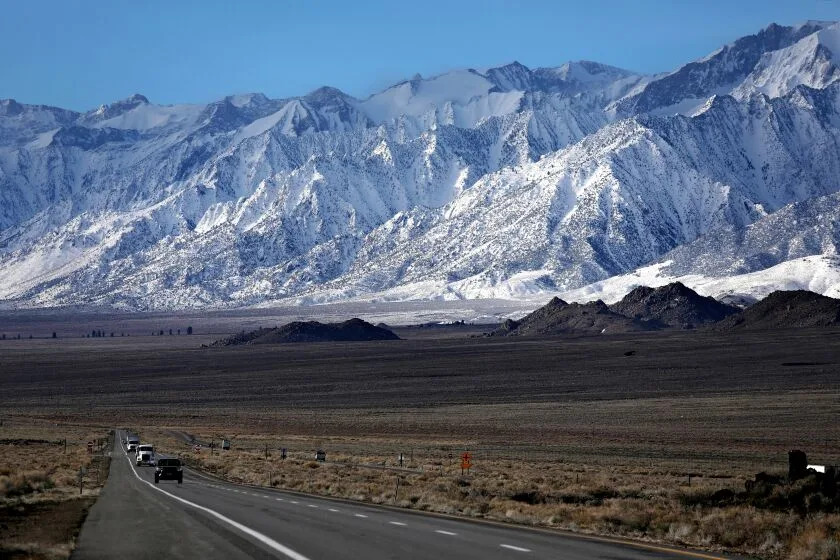 LONE PINE, CA - MARCH 22: The east side of the Sierra Nevada mountain range along HWY 395 on Wednesday, March 22, 2023 in Lone Pine, CA. Flash flooding along the eastern Sierra Nevada a week ago caused an unprecedented breach in the City of Los Angeles Department of Water and Power Los Angeles Aqueduct, as well as other damage. (Gary Coronado / Los Angeles Times)