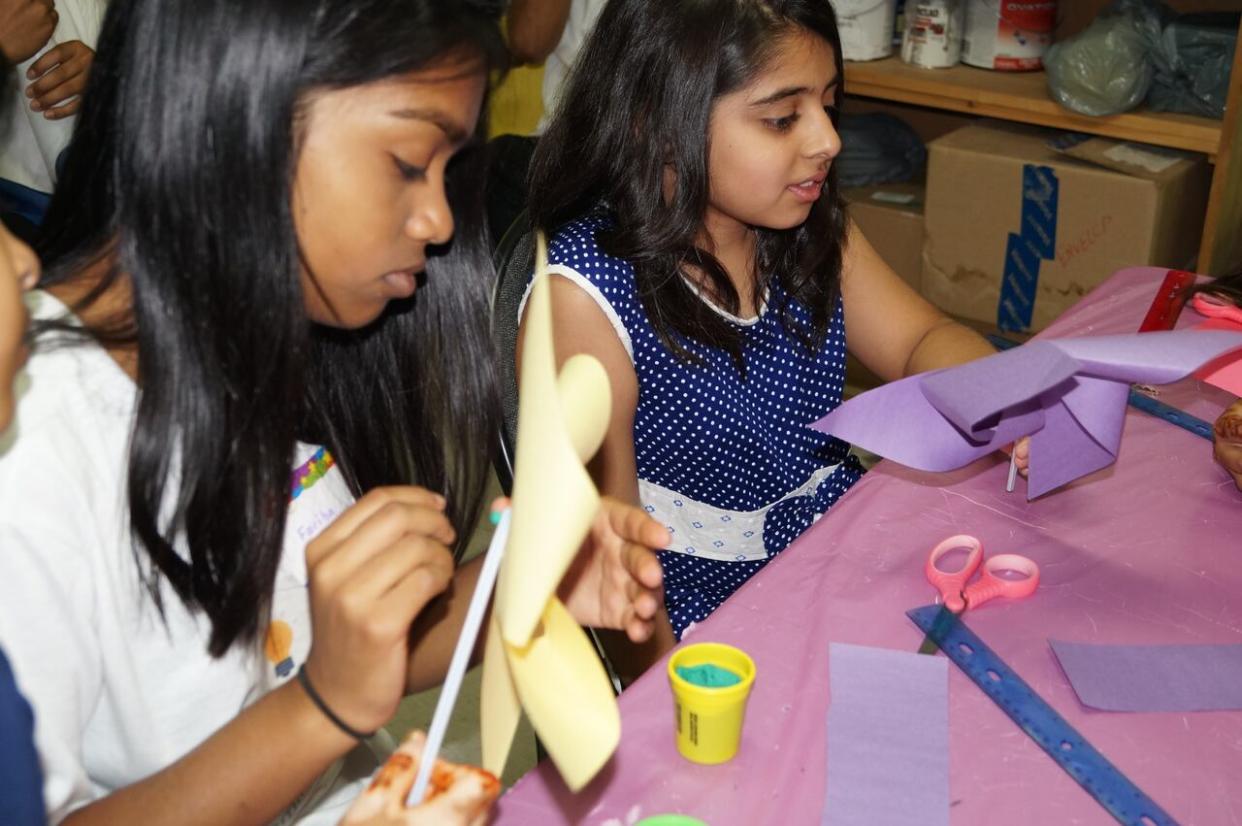 Two girls during an event by FeminSTEM, which empowers young girls to chart a path in the world of science, math, engineering and technology. (Submitted by Atqiya Fariha  - image credit)