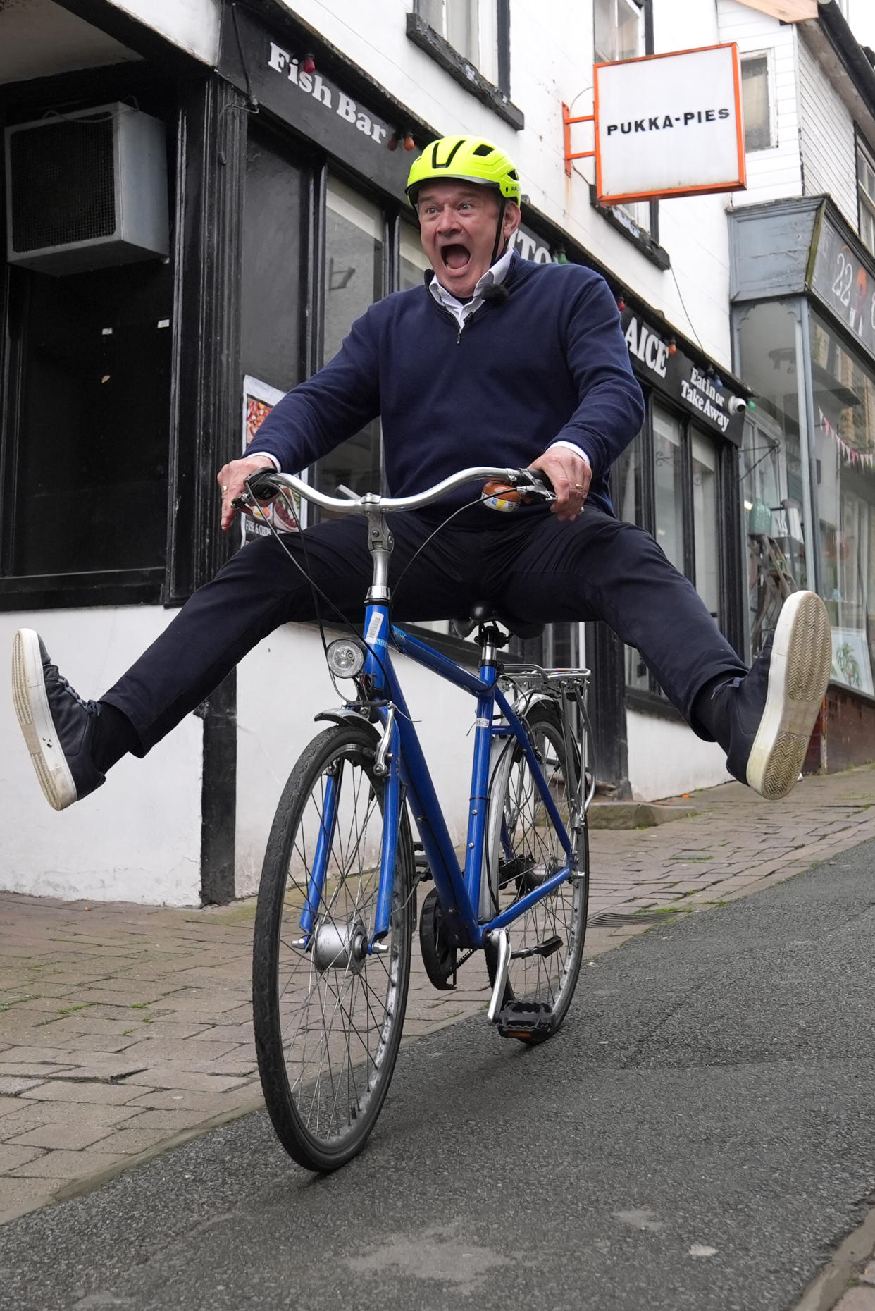 It’s all downhill from here for Lib Dem Leader Sir Ed Davey as he rides a bike in Knighton, Powys (Jacob King/PA)