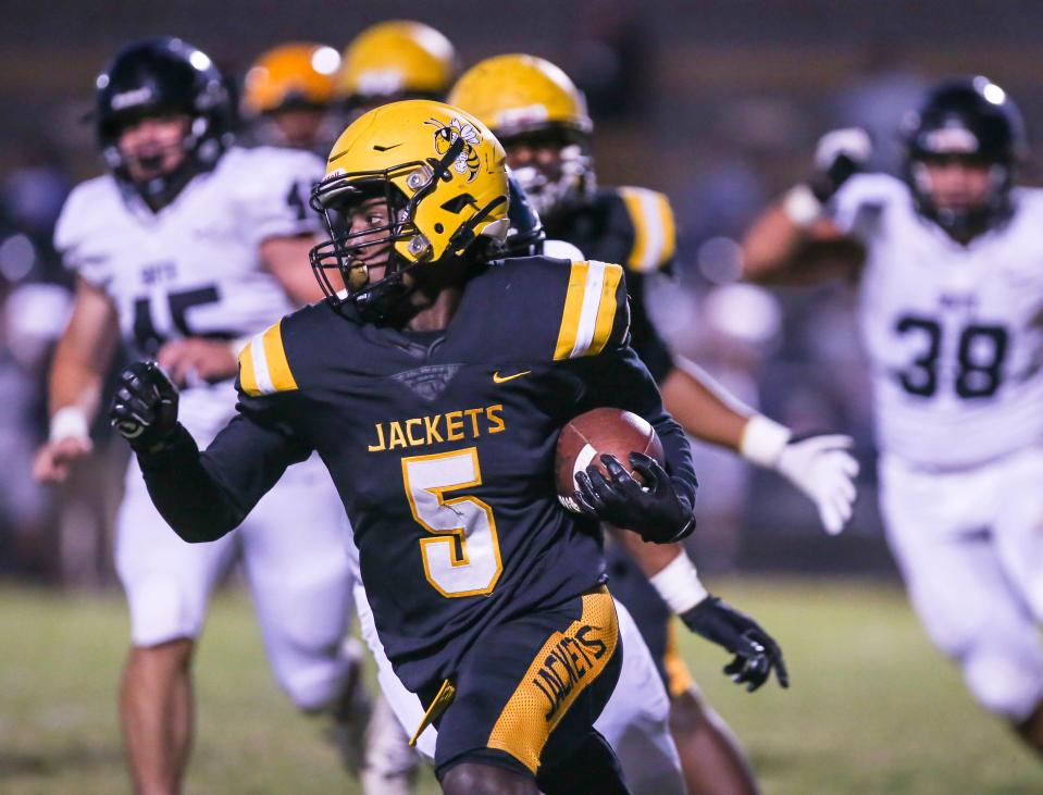 Central's Cortez Stone runs for yardage in the first half Friday night. Sept. 43, 2021