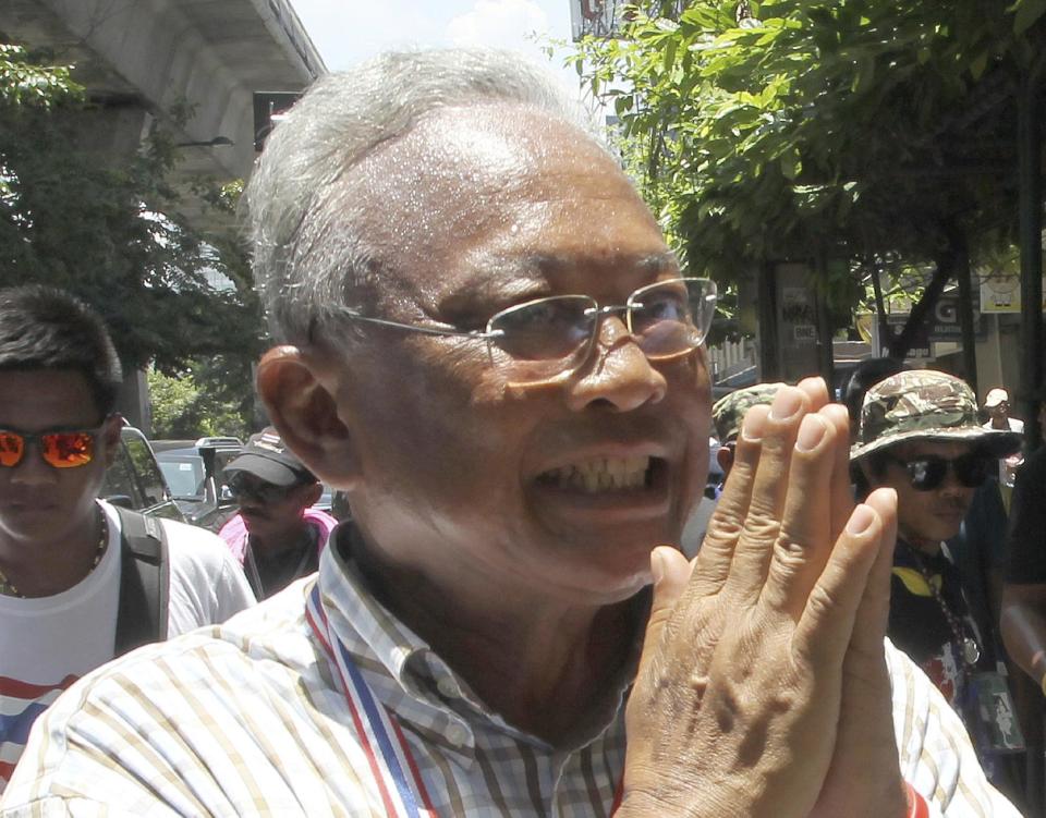 Anti-government protest leader Suthep Thaugsuban greets supporters during a rally Thursday, May 8, 2014 in Bangkok, Thailand. A court ousted Thailand's prime minister Yingluck Shinawatra for abuse of power, accomplishing what anti-government demonstrators have sought to do for the past six months and further widening the country's sharp political divide. Suthep told his followers that they would stage a "final offensive" on Friday and would achieve their goal of fully ousting the government. (AP Photo/Apichart Weerawong)
