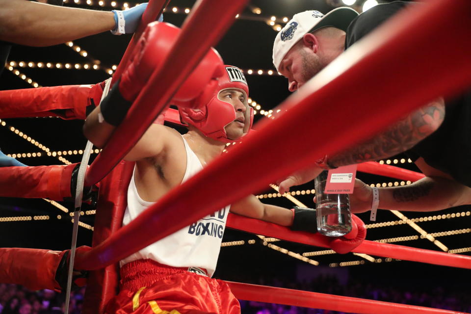 <p>Richie Fuentes gets instructions in between rounds in the CO vs. NCO 72 Supremacy during the NYPD Boxing Championships at the Hulu Theater at Madison Square Garden on March 15, 2018. (Gordon Donovan/Yahoo News) </p>