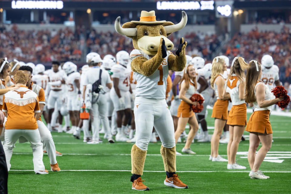 ARLINGTON, TX - DECEMBER 02: The Texas Longhorns mascot tries to fire up the crowd during the Big 12 Championship football game between the Texas Longhorns and Oklahoma State Cowboys on December 02, 2023 at AT&T Studium in Arlington, Texas. (Photo by Matthew Visinsky/Icon Sportswire via Getty Images)