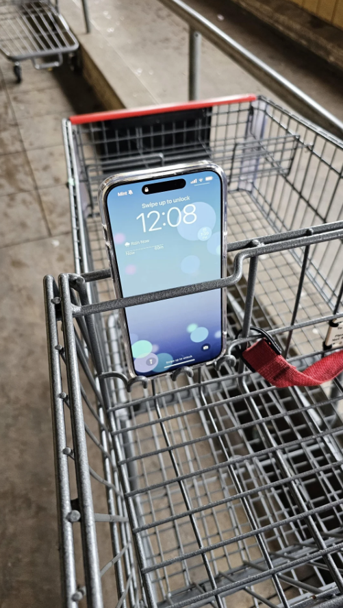 a phone holder on a grocery cart