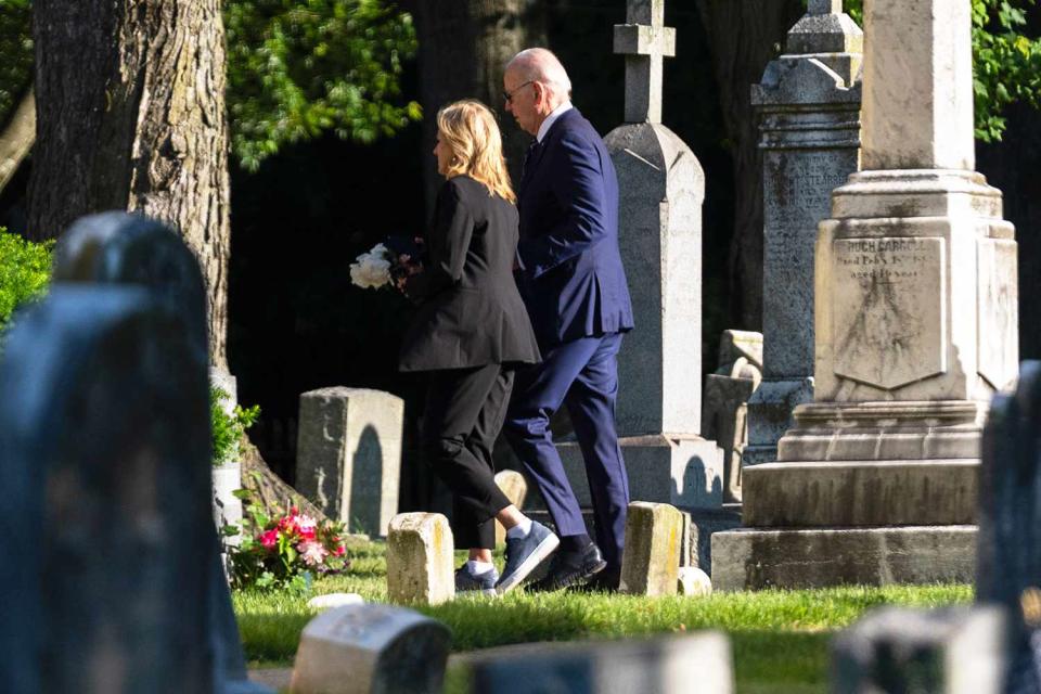 <p>Evan Vucci/AP</p> Joe and Jill Biden walk into church for a private service to mark the ninth anniversary of Beau Biden