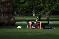 People exercise in St James Park in London, Sunday, May 10, 2020 during the nation-wide coronavirus lockdown. (AP Photo/Frank Augstein)