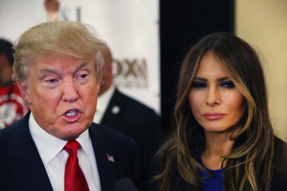 Republican presidential candidate Donald Trump and his Melania speak with members of the media in the spin room after the Republican Presidential Debate sponsored by Fox Business and the Wall Street Journal at the Milwaukee Theatre on November 10, 2015 in Milwaukee, Wisconsin. The fourth Republican debate is held in two parts, one main debate for the top eight candidates, and another for four other candidates lower in the current polls. (Photo by Scott Olson/Getty Images)