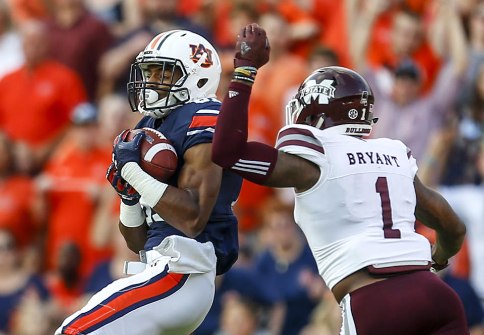 Auburn wide receiver Darius Slayton (81) catches a pass over Mississippi State defensive back Brandon Bryant (1) during the first half of an NCAA college football game, Saturday, Sept. 30, 2017, in Auburn, Ala. (AP Photo/Butch Dill)