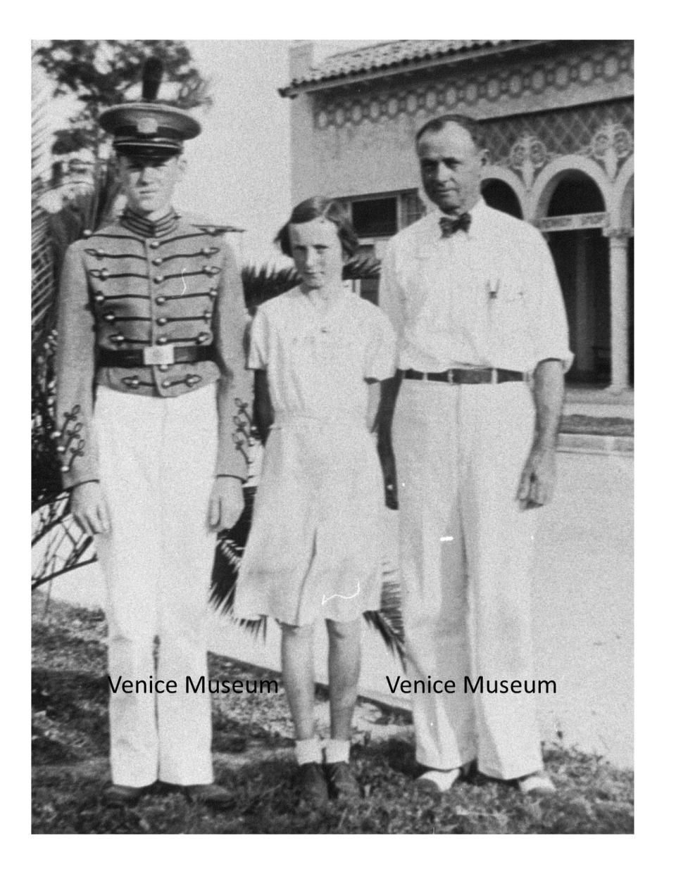 A young Julia Cousins poses with her older brother Jimmy in his Kentucky Military Institute uniform and their father Mitt Cousins.
