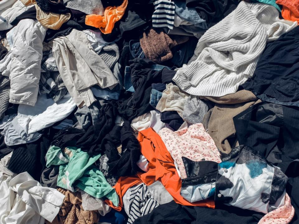 Some 92 million tonnes of clothing end up in landfill every year (Getty)