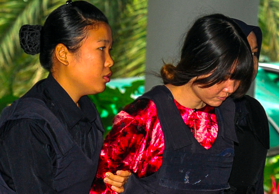 <em>Doan Thi Huong (right) is one of the women who will stand trial for the murder (Rex)</em>