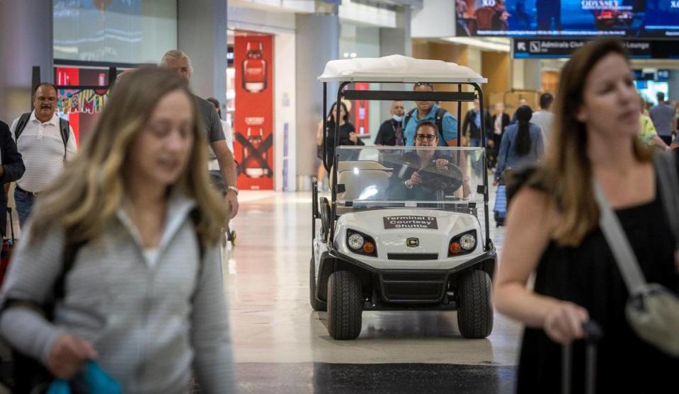 A courtesy shuttle makes its way along Concourse D at Miami International Airport. The Skytrain is down indefinitely as airport administrators consider the next steps.