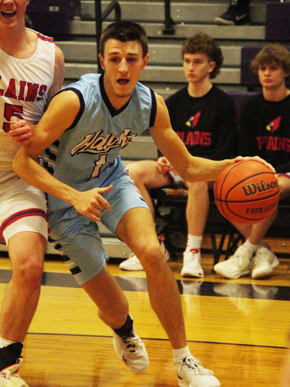 Prairie Central's Dylan Bazzell drives the baseline against Pleasant Plains Saturday. Bazzell had 10 points in a 41-27 victory.