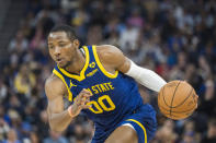 Golden State Warriors forward Jonathan Kuminga dribbles during the first half of an NBA basketball game against the Utah Jazz, Sunday, April 7, 2024, in San Francisco. (AP Photo/Nic Coury)