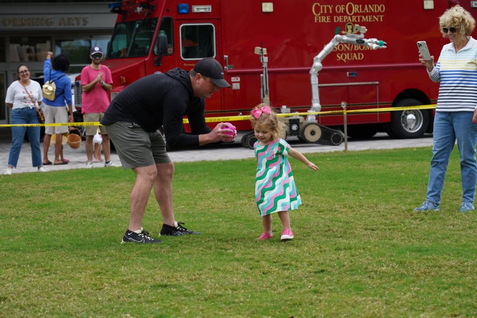 Firefighters with the Orlando Fire Department helped children with an Easter egg hunt.