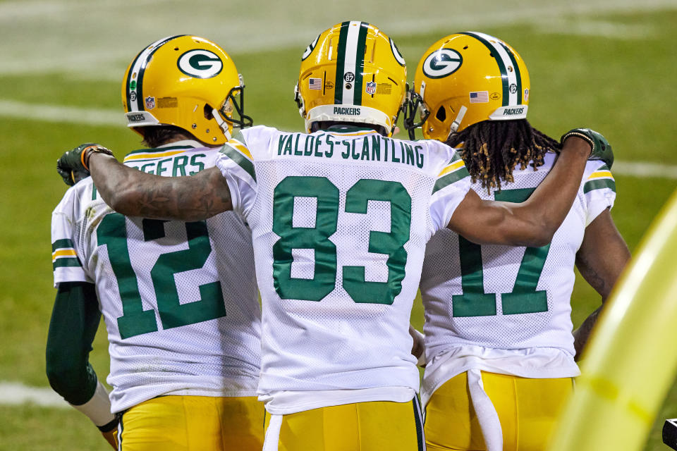 CHICAGO, IL - JANUARY 03: Green Bay Packers wide receiver Davante Adams (17) celebrates with wide receiver Marquez Valdes-Scantling (83) and quarterback Aaron Rodgers (12) after scoring a touchdown  in action during a game between the Chicago Bears and the Green Bay Packers on January 03, 2021 at Soldier Field in Chicago, IL. (Photo by Robin Alam/Icon Sportswire via Getty Images)