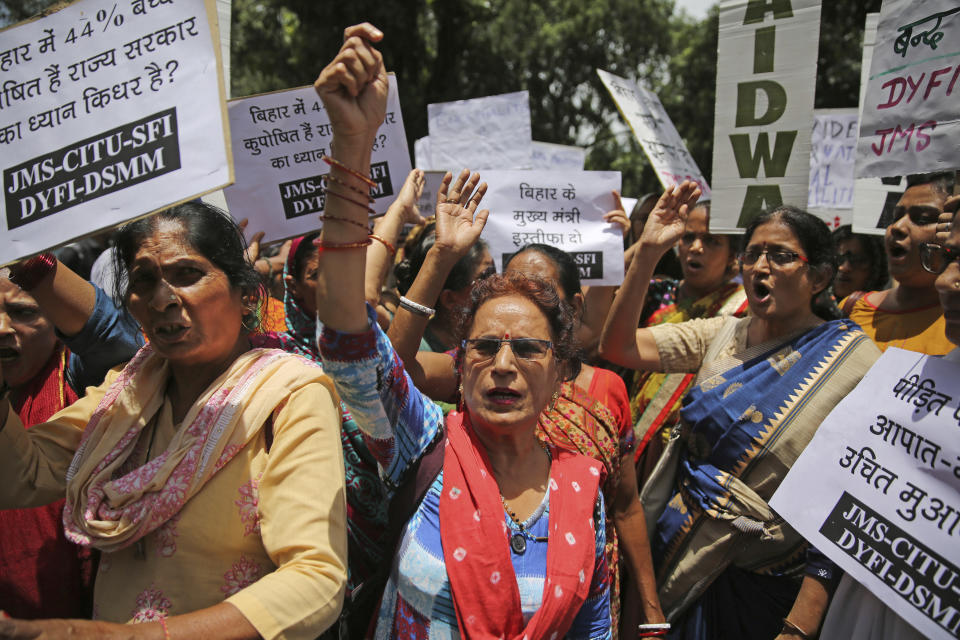 Left wing activists shout slogans as they protest against deaths of more than 100 children due to Encephalitis in the Indian state of Bihar, in New Delhi, India, Tuesday, June 18, 2019. (AP Photo/Altaf Qadri)