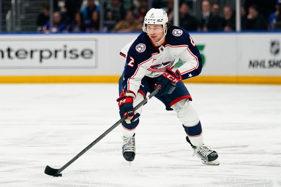 Columbus Blue Jackets' Andrew Peeke looks to pass the puck during the first period of the team's NHL hockey game against the New York Islanders on Thursday, Dec. 29, 2022, in Elmont, N.Y. (AP Photo/Frank Franklin II)