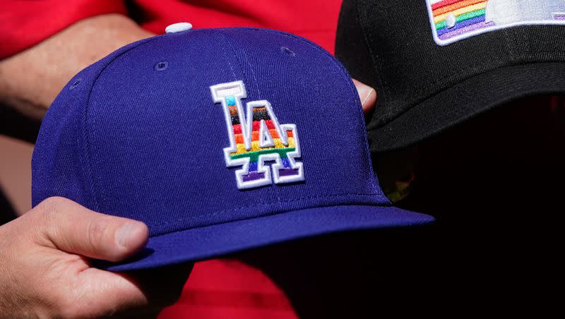 A Los Angeles Dodgers hat with a rainbow logo is pictured on Pride Day at Oracle Park before a baseball game between the Giants and the Dodgers in San Francisco, Saturday, June 11, 2022.