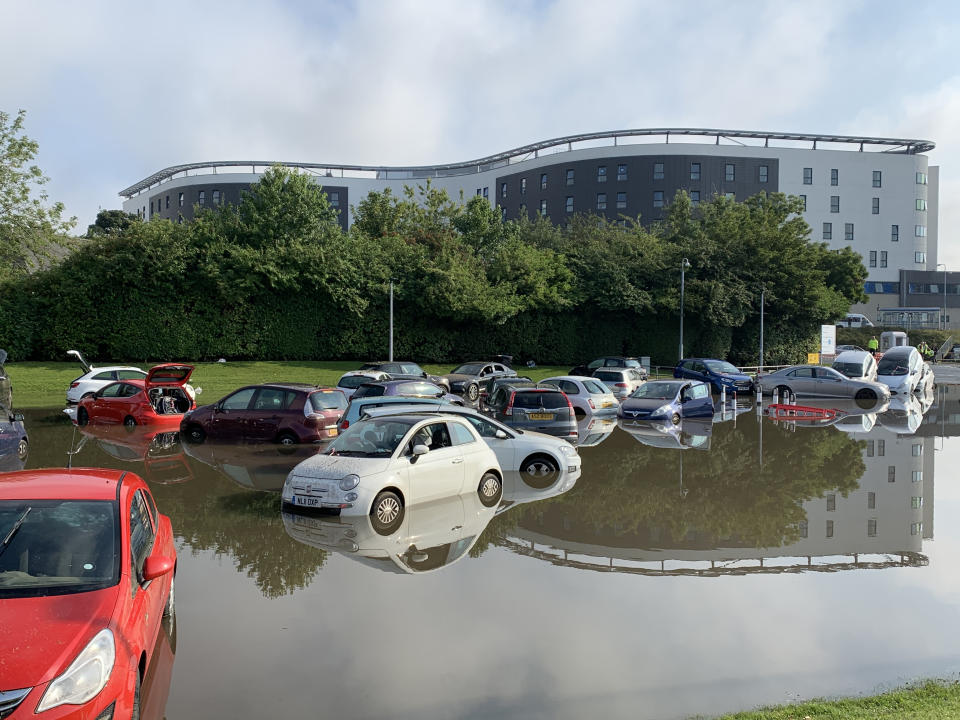 Flooding at Queen Victoria Hospital car park, in Kirkcaldy, Fife, Scotland. Thunderstorm warnings are still current for most of the UK on Wednesday, while high temperatures are forecast again for many parts of England.