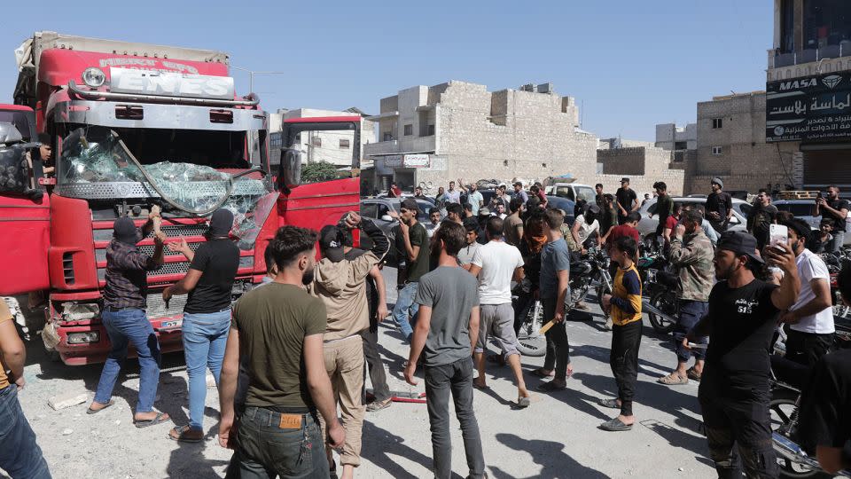 Protesters in al-Bab, Aleppo, Syria, attack a Turkish truck during demonstrations against Turkey on July 1, 2024. - Bakr Alkasem/AFP/Getty Images