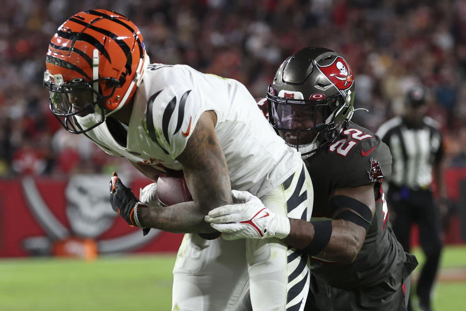 Cincinnati Bengals wide receiver Ja'Marr Chase (1) scores a touchdown against the Tampa Bay Buccaneers during the second half of an NFL football game, Sunday, Dec. 18, 2022, in Tampa, Fla. (AP Photo/Mark LoMoglio)
