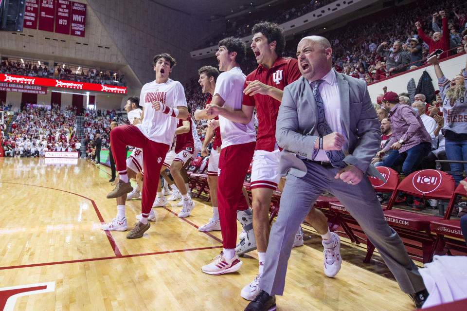 Indiana players and staff reacts on the sideline during the second half of a NCAA college basketball game against Nebraska, Saturday, Dec. 4, 2021, in Bloomington, Ind. (AP Photo/Doug McSchooler)