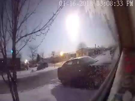 A meteor is caught on security camera footage in a residential area in Newport, Michigan, U.S., January 16, 2018 in this still image from video obtained from social media. Kevin McCombs/via REUTERS