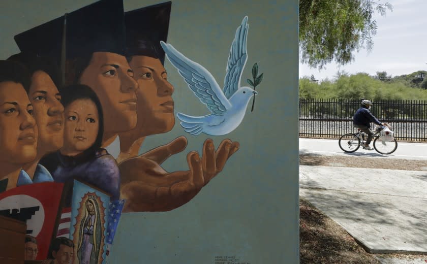 SAN FERNANDO, CA - JUNE 23: A mural by artist Ignacio Gomez stands adjacent to the Mission City Trail along the San Fernando Road bike path on Tuesday, June 23, 2020 in San Fernando, CA. The bike path runs 5.7 miles from Sylmar to Pacoima. (Myung J. Chun / Los Angeles Times)