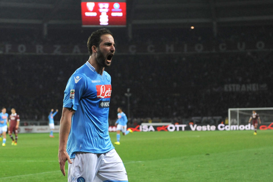 Napoli forward Gonzalo Higuain celebrates after scoring during a Serie A soccer match between Napoli and Torino, at the Olympic stadium, in Turin, Italy, Monday, March 17, 2014. (AP Photo/Massimo Pinca)