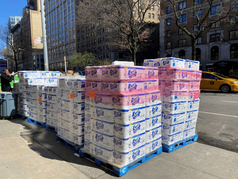 Pallets of toilet paper fill the sidewalk in front of grocer Fairway in Manhattan on Sunday after panicky shoppers depleted shelves, amid fears of the global growth of coronavirus cases, in Manhattan, New York