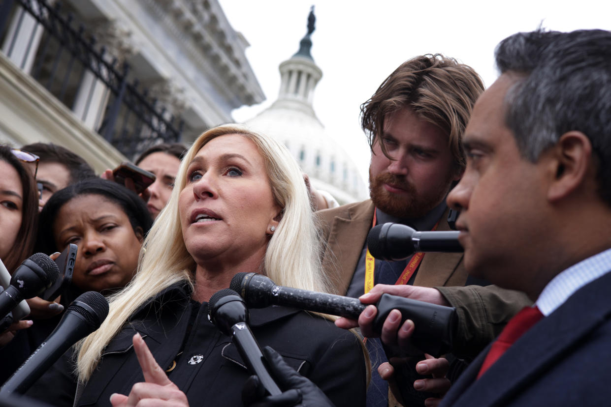 Rep. Marjorie Taylor Greene speaks to reporters outside of the U.S. Capitol building.