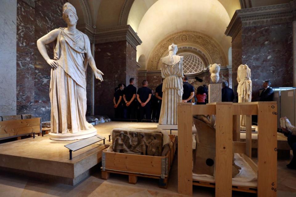 Crates with pieces of artworks from the collections of the Louvre Museum. <span class="inline-image-credit">(Reuters/John Schults)</span>